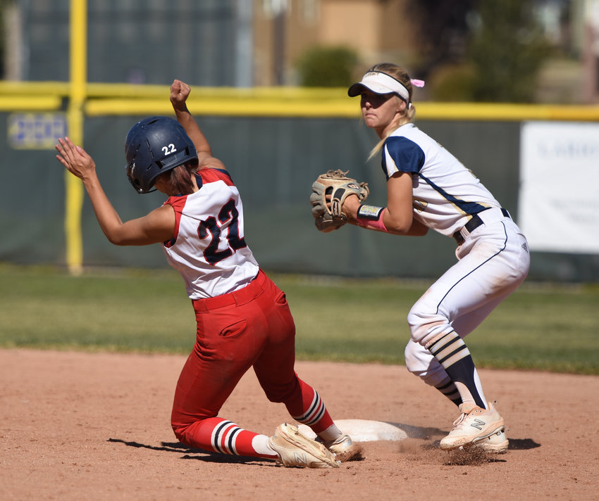 Heritage's Jojo Gladu (22) is forced out at second by Legacy's Kate Walker during a CHSAA 5A regional round playoff game at Legacy High School Oct. 16. Legacy rallied to beat Heritage 8-7 and handled Cherokee Trail 7-2 to advance to the state tournament this week.